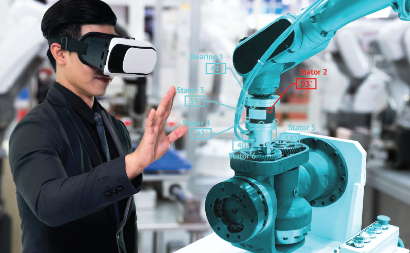 Photograph of a person using Augmented Reality glasses to operate a machine.