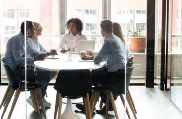 A group of people sitting at a table.