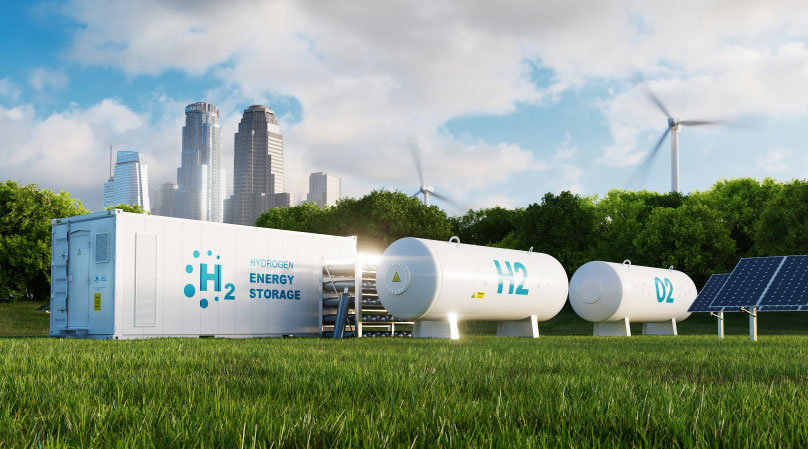 A hydrogen hub center sits on a lush green field.