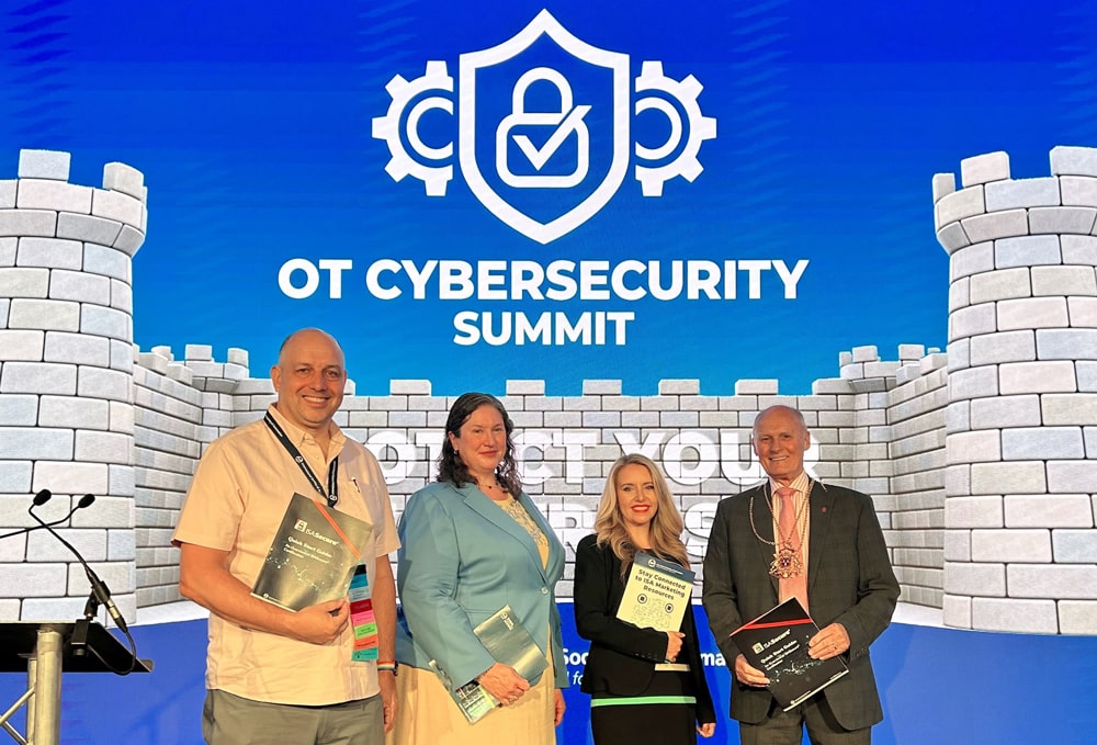 Pictured, from left:  Steve Mustard (ISA Treasurer and ISA OT Cybersecurity Summit conference committee chair); Cheri Caddy (Deputy Assistant National Cyber Director, The White House); Megan Samford (Vice President and Chief Product Security Officer for energy management at Schneider Electric) and Dr David Cameron, Lord Provost of Aberdeen. 